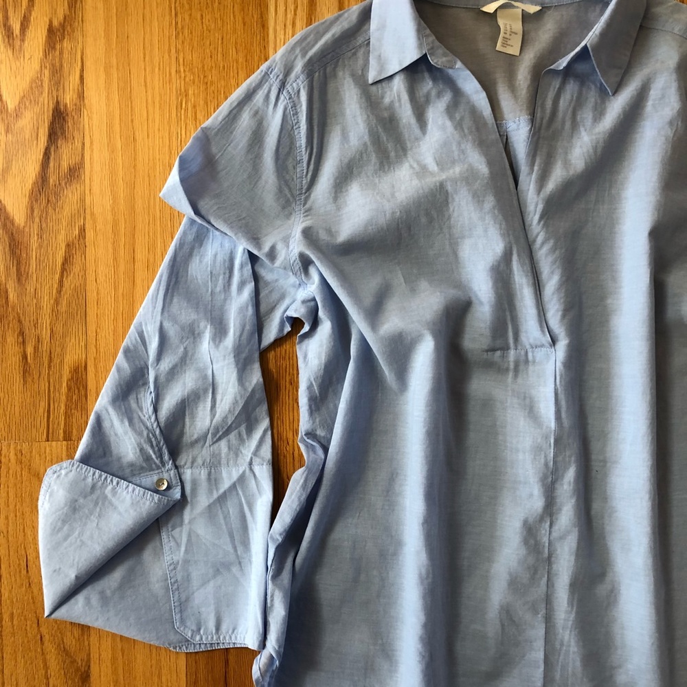 Blue collared shirt with oversized cuff